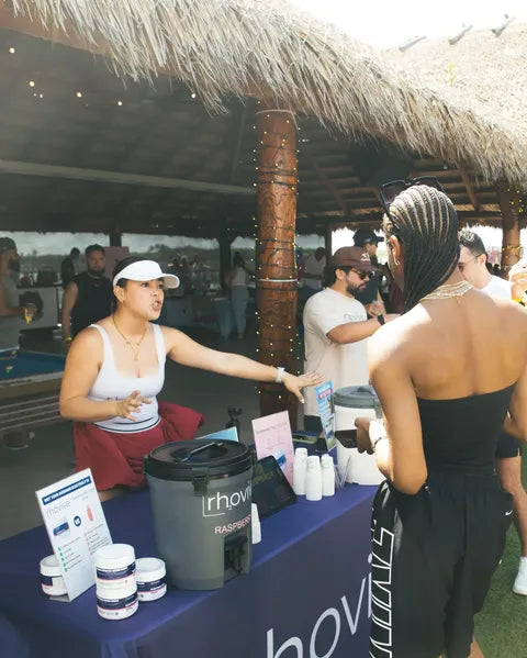 A Rhovive founder explaining the product to visitors at the Raspberry cooler
