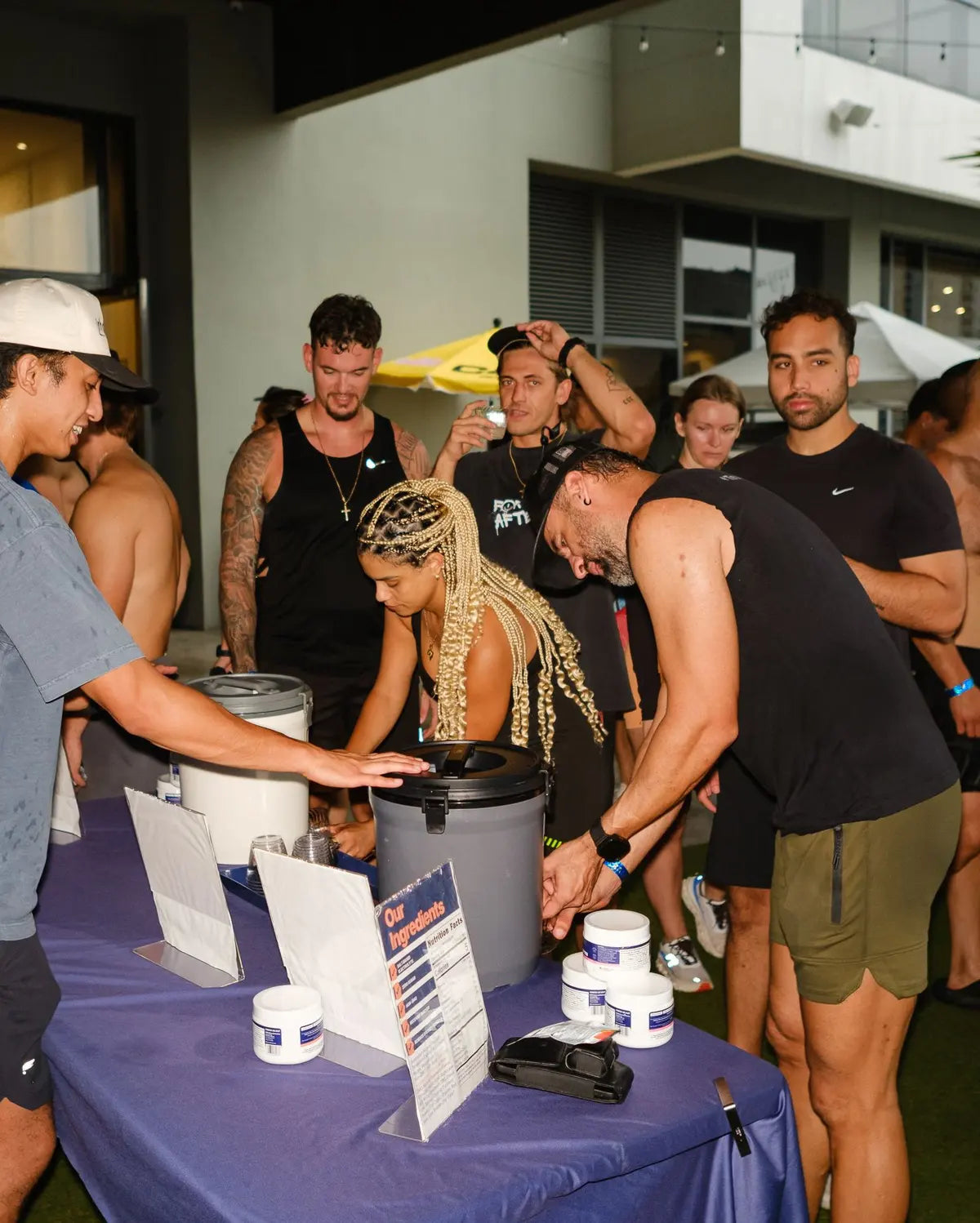 A crowd lining up for Rhovive samples after an evening workout