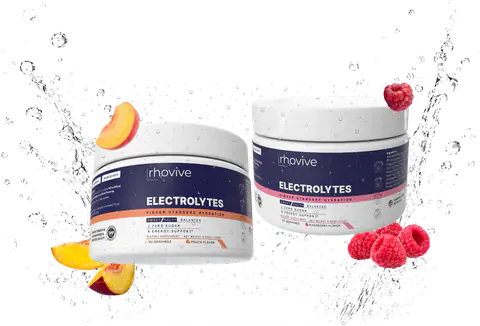 A jar of Rhovive Peach and a jar of Rhovive Raspberry with their fruit in a splash of water