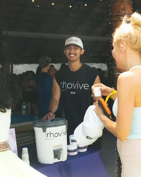 A Rhovive founder serving samples from the Peach cooler